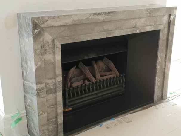 Greg and alisa Bronto Marble Fireplace with jet black granite (3)